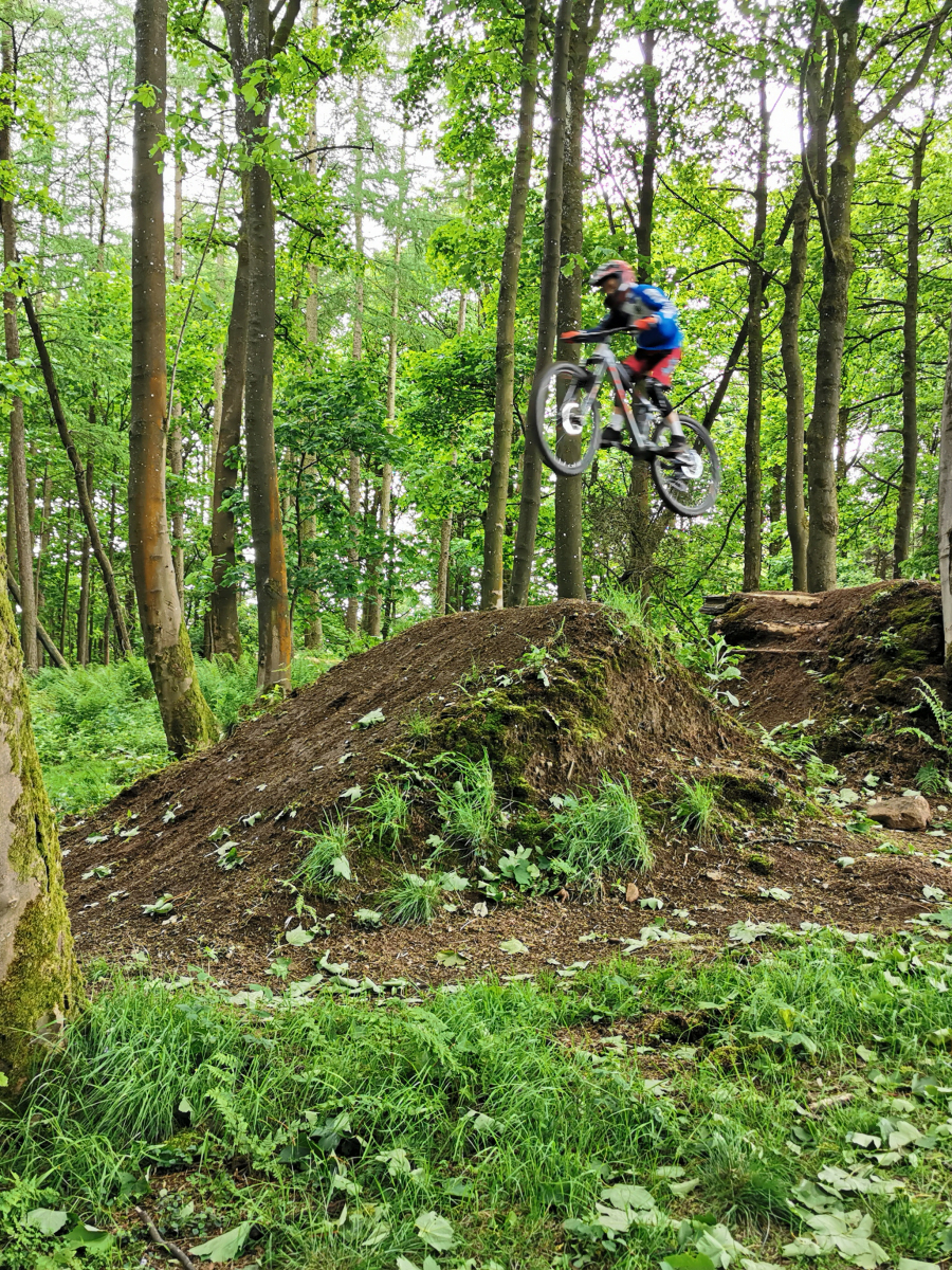 Emily Cook: My brother going over some of the big jumps in the woods